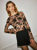 Clara | Elegante Bluse mit Glockenärmeln und halbtransparenter Beflockung